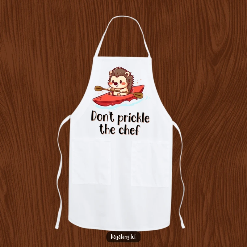 Funny apron with a smiling hedgehog steering a bright red kayak, perfect for adding a touch of humor and protection while cooking.