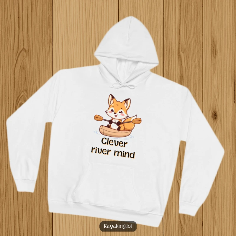 Funny grinning fox with sparkling eyes in a kayak, depicted on a cozy hoodie, ideal for adventurous souls and fox lovers.