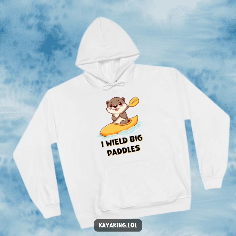 Funny hoodie showcasing a happy otter steering a kayak with a comically large paddle, offering warmth and amusement.
