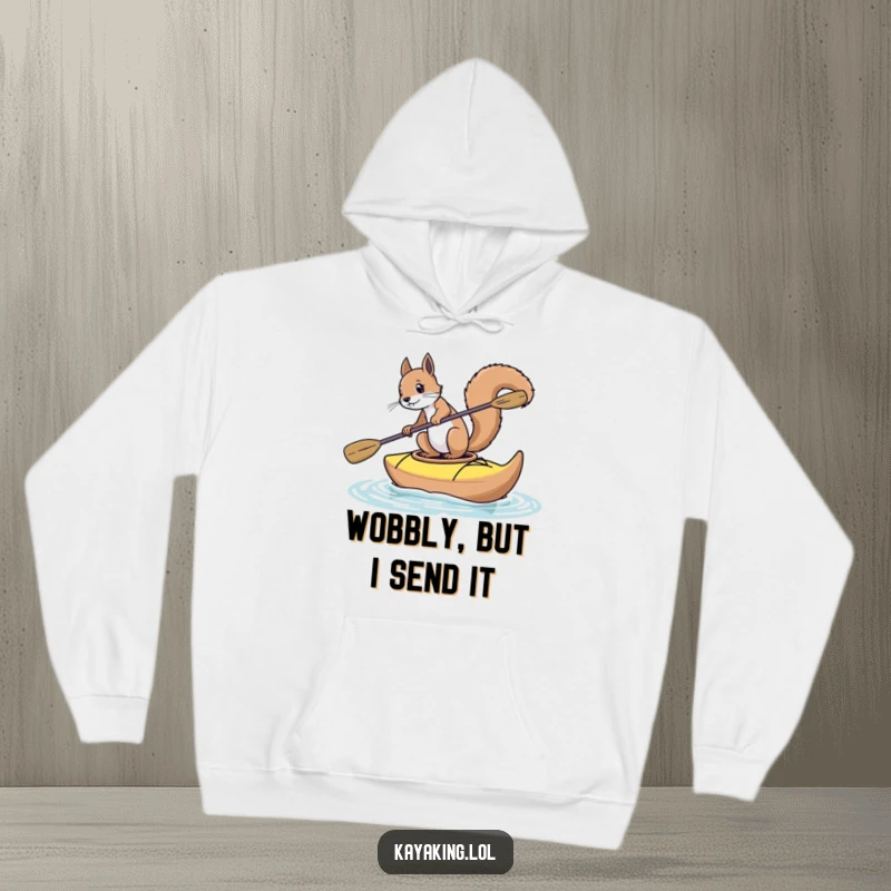 Funny squirrel hoodie showing a squirrel attempting to paddle a wobbling kayak, capturing a moment of wild, humorous adventure.