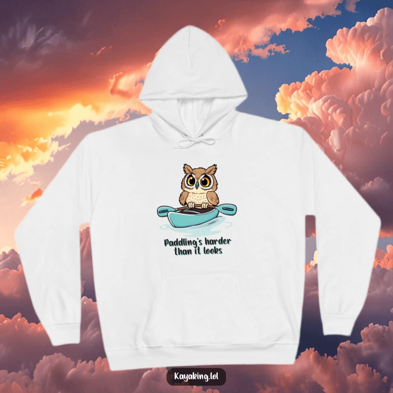 Funny owl hoodie depicting a startled bird in a kayak, its wide eyes expressing pure shock as the boat tilts precariously, a humorous nature design.