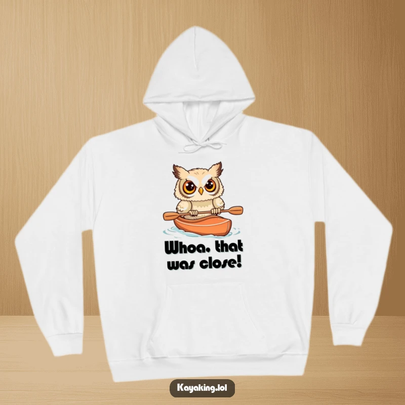 Funny Startled Owl Kayak Hoodie: A startled owl's kayak adventure gone wrong, a humorous and warm piece.