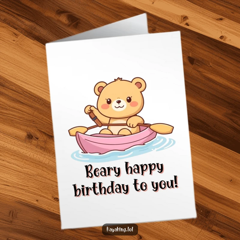 Funny Free Printable Birthday Card: A joyful bear waves cheerfully from its kayak, sending happy birthday wishes.