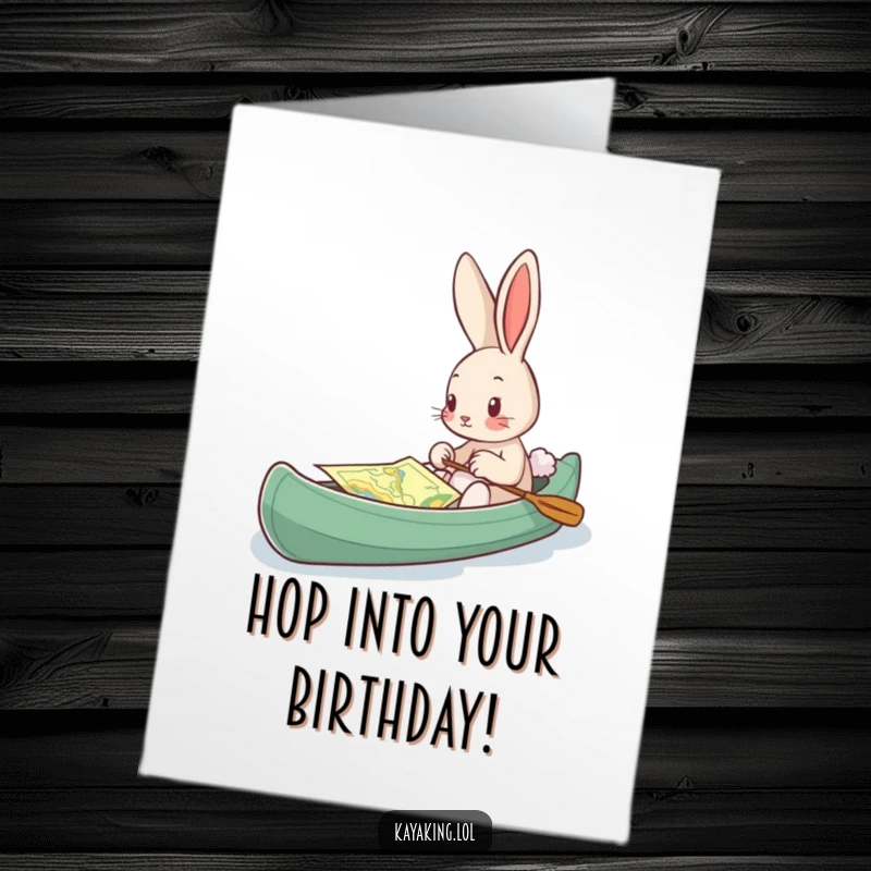Funny Free Printable Birthday Card: A curious bunny studies a map while in a kayak, planning a birthday journey.