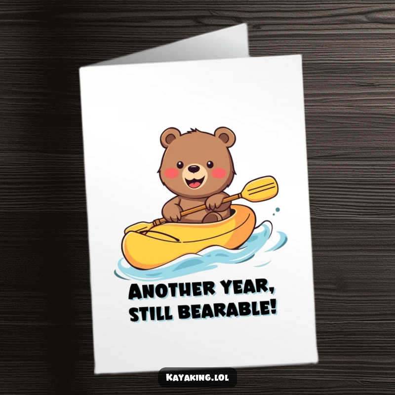 Funny Free Printable Birthday Card: Smiling bear waving happily from a colorful kayak, a cheerful downloadable greeting.