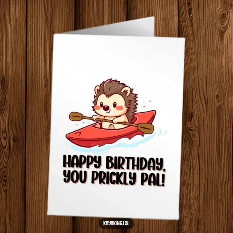 Funny Free Printable Birthday Card: A playful hedgehog steers a bright red kayak with a smile.