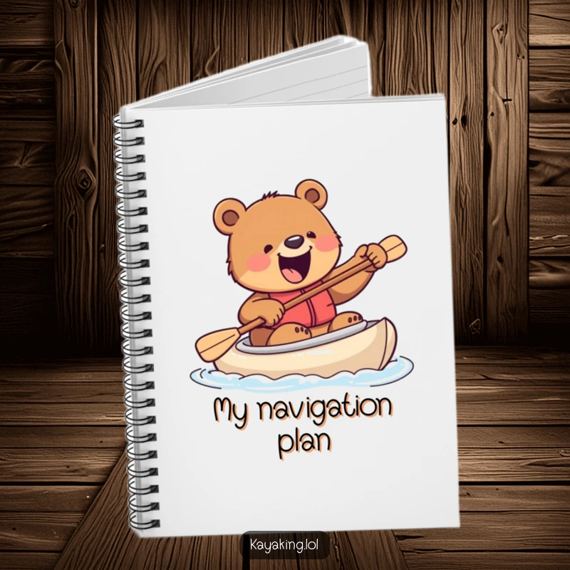 Funny notebook with an excited bear attempting to steer a kayak with a paddle, ideal for jotting down adventurous plans and big ideas.