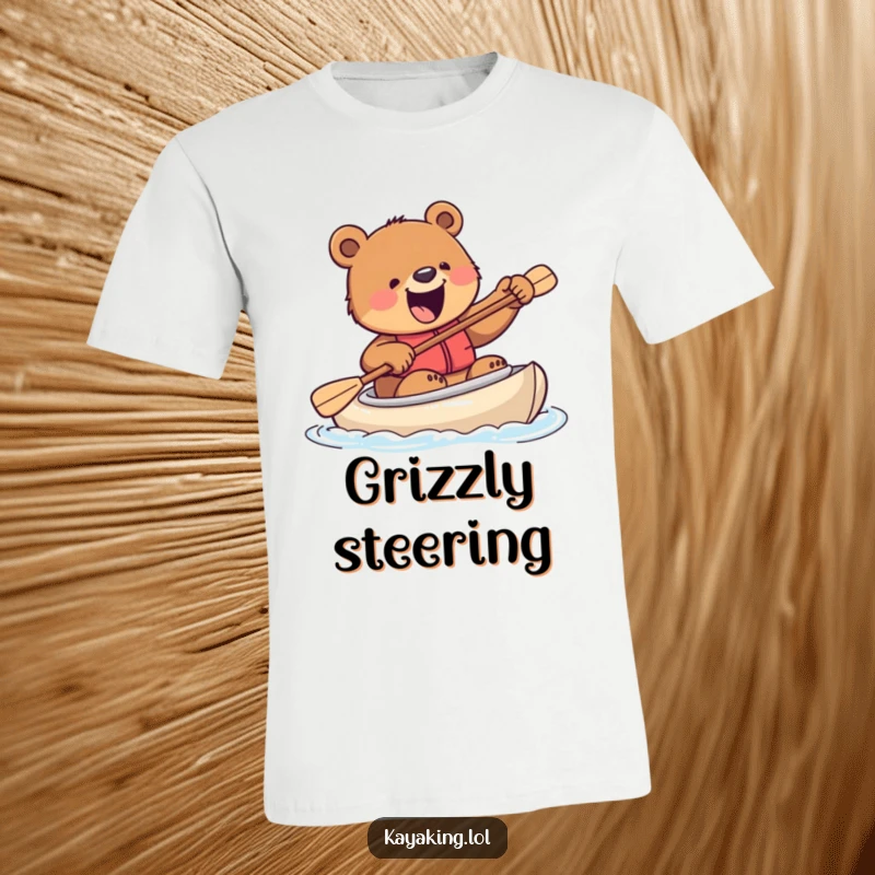 Funny t-shirt with an excited bear clumsily attempting to steer a kayak with a paddle, conveying pure, unbridled enthusiasm.