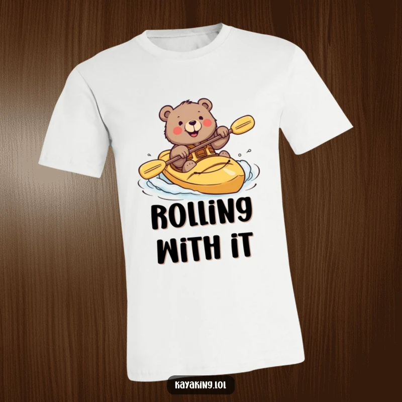 Funny t-shirt featuring a brave bear with a smile attempting a challenging kayak roll.