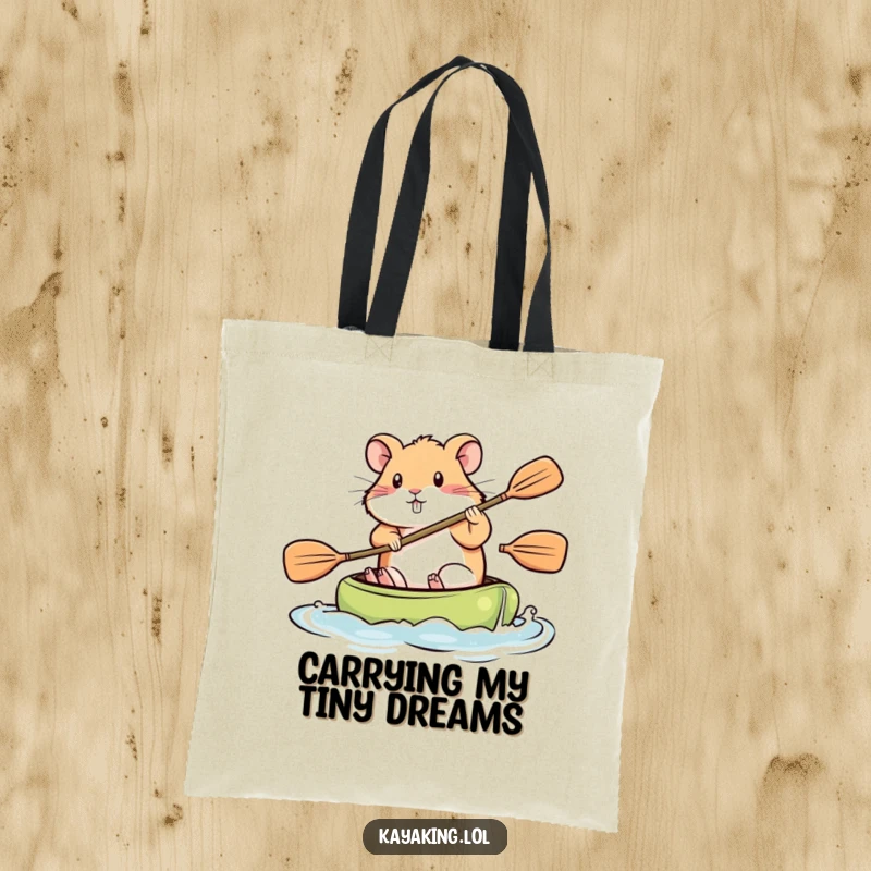 Funny Tote Bag, a hamster paddling a kayak vigorously, highlighting determination and carrying capacity.