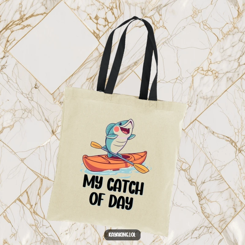 Funny fish kayak tote bag featuring a joyfully leaping fish from a kayak, ideal for carrying fishing gear with humorous style.