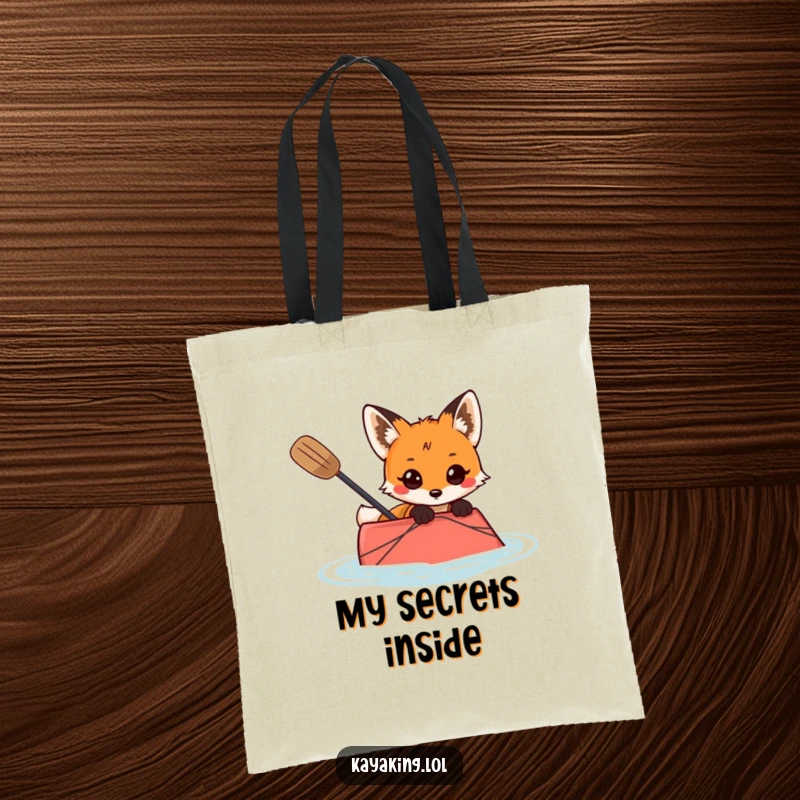 Funny tote bag showing a curious fox peeking over the edge of a kayak, ready for discovery.